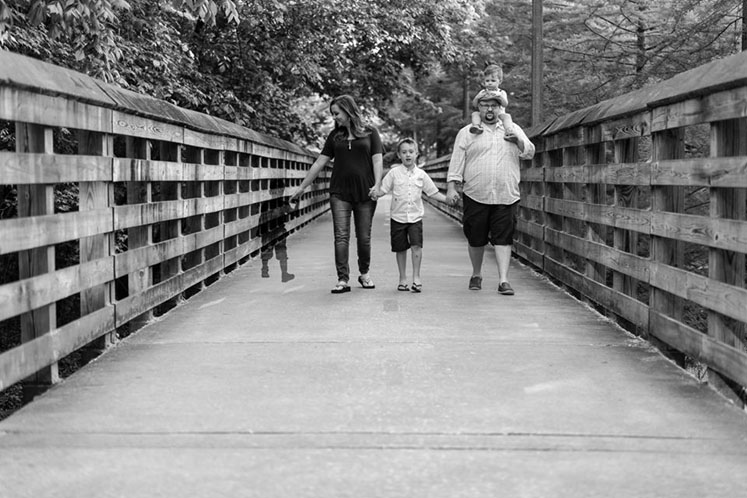 Family walking, black and white